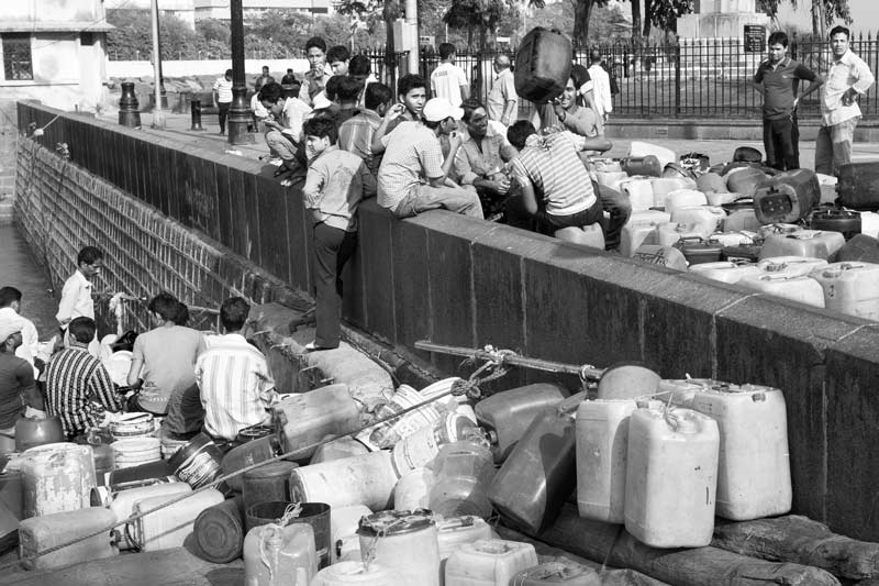 Men and Drinking Water Procurement - Boatmen queuing up for collecting potable water in Mumbai, Maharashtra